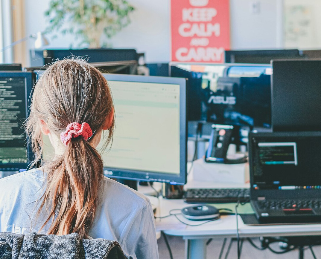 programmers coding at desk